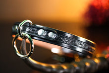 Load image into Gallery viewer, 3/4&quot; Handmade leather BDSM collar with filigree embossing and nickel plated hardware. Color: Black. Close up front.
