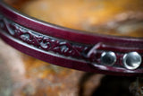 3/4" Handmade leather BDSM collar with filigree embossing and nickel plated hardware. Color: Cordovan. Close up